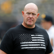 In this Sept. 1, 2018, file photo, Iowa strength and conditioning coach Chris Doyle walks on the field before an NCAA college football game between Iowa and Northern Illinois, in Iowa City, Iowa. Former players have accused Doyle of bullying and making racist comments.